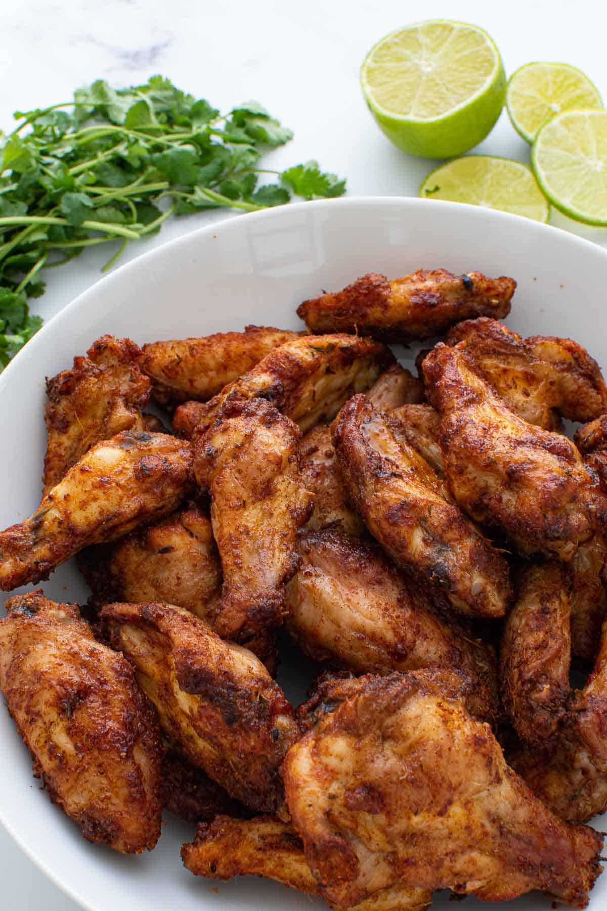 Close up of Cajun wings on a plate.