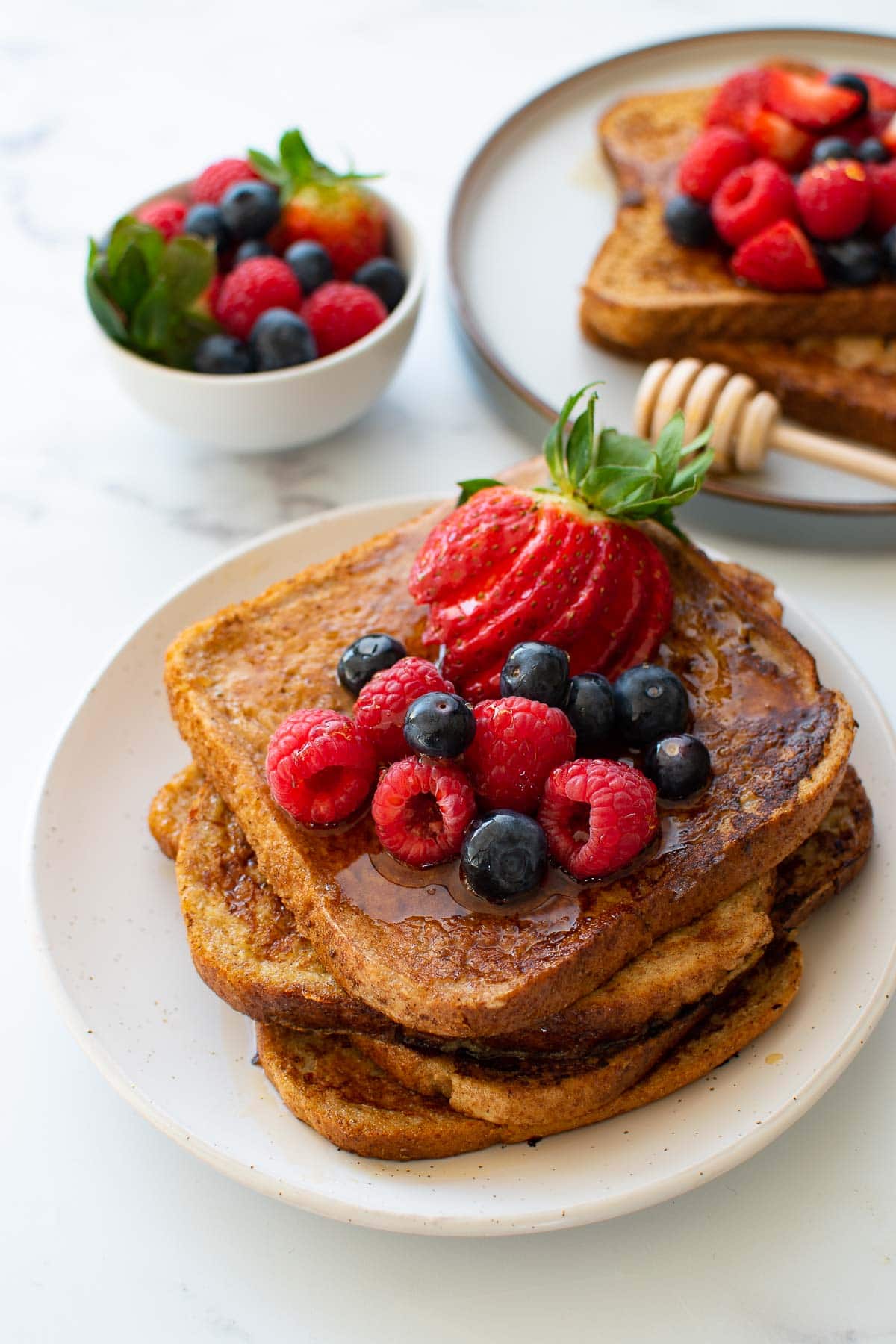 Healthy French toast with strawberries, raspberries and blueberries.