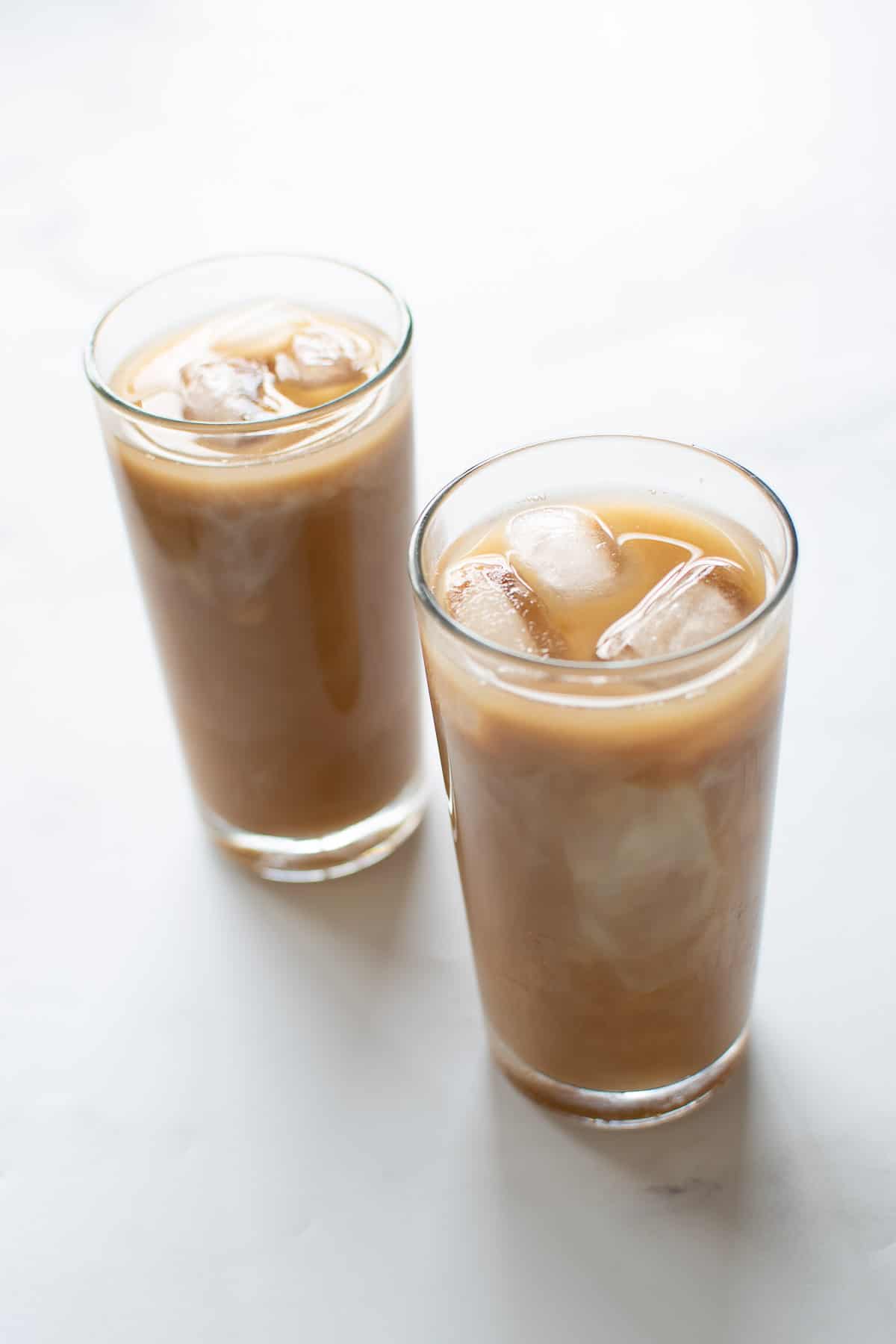 Two glasses of iced caramel latte.