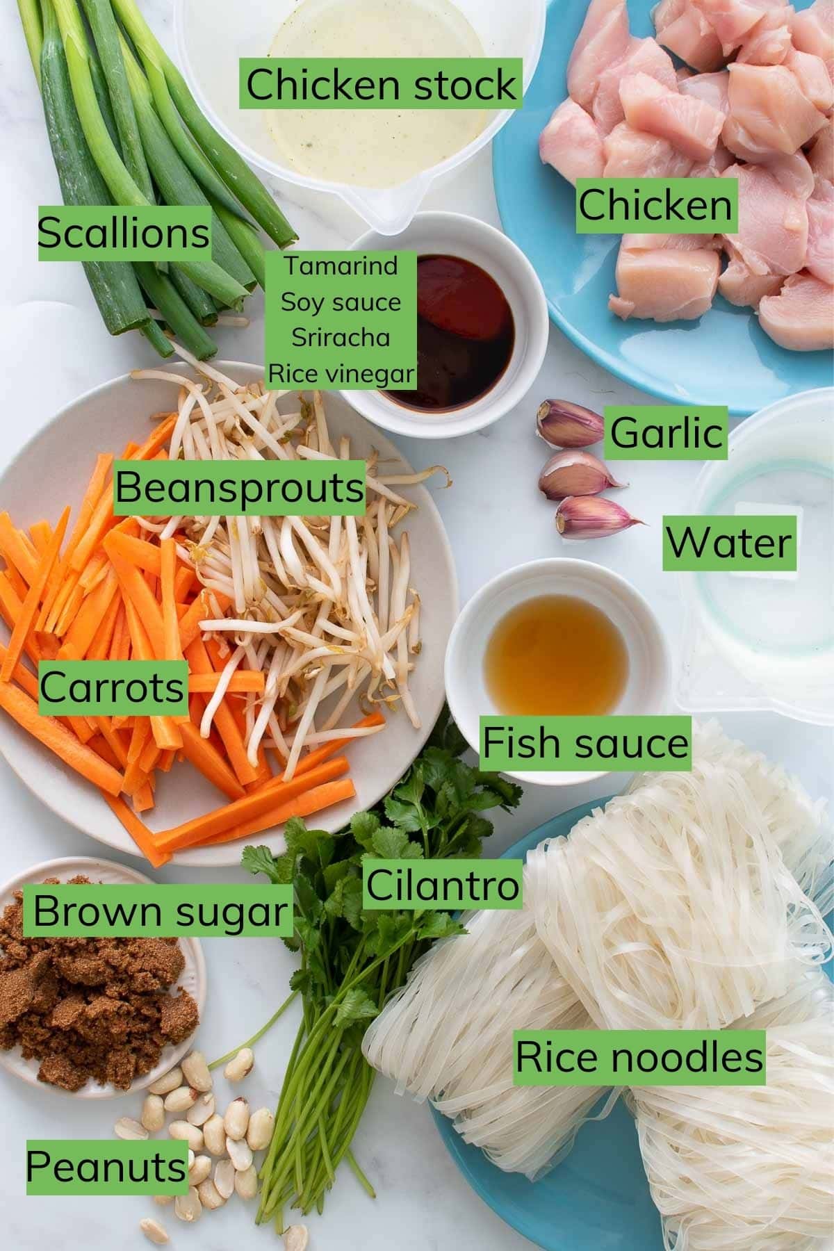 The ingredients to make pad thai laid out on a table.