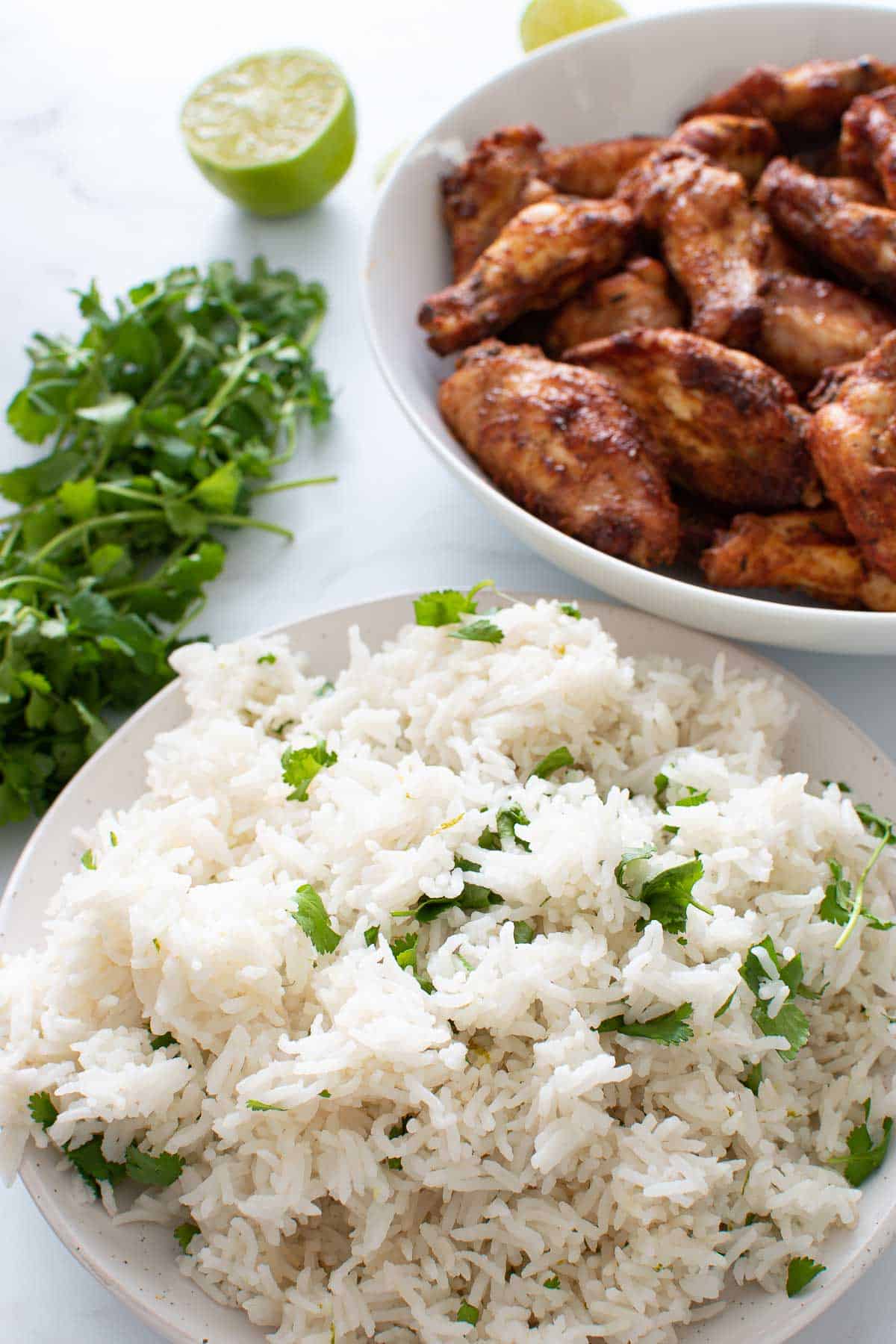 Lime and cilantro rice with chicken wings on the side.