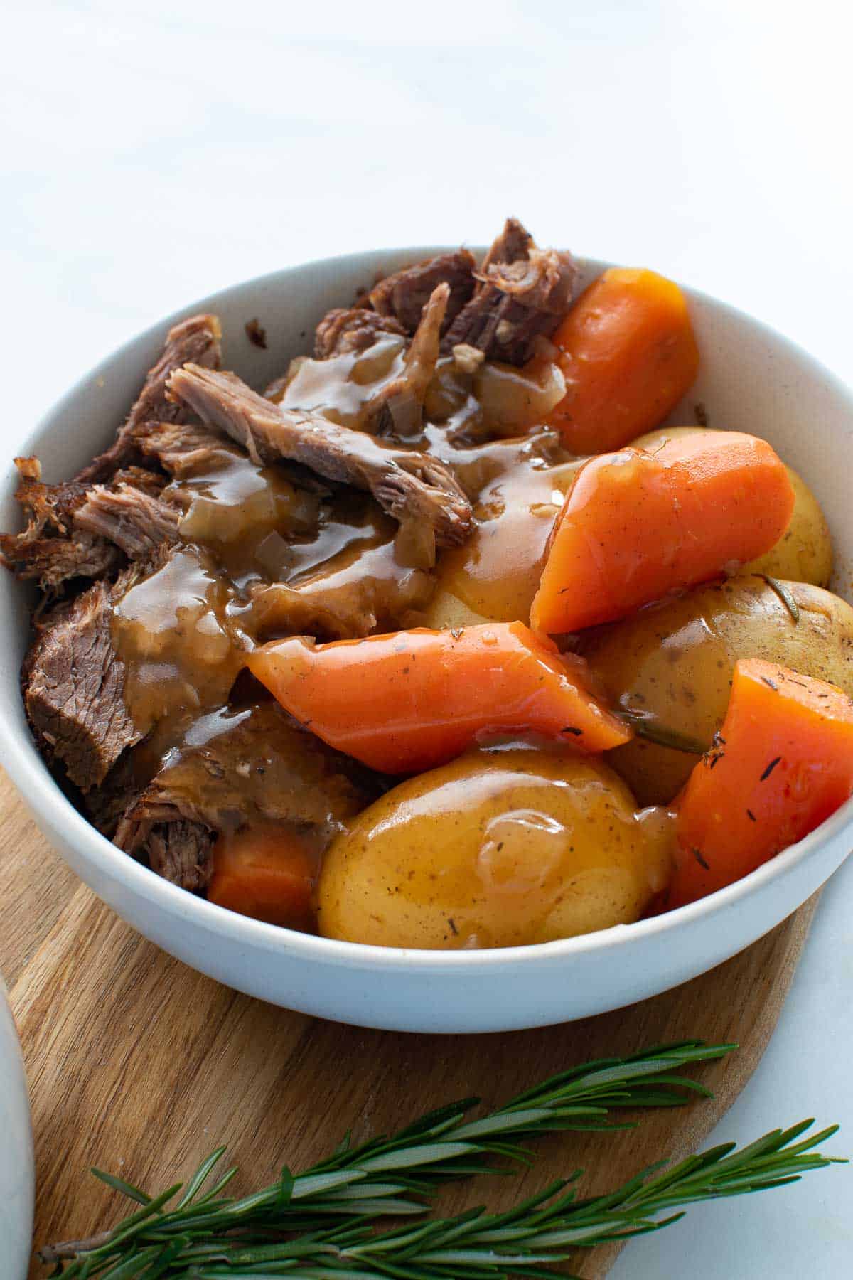 Close up of a bowl of pot roast.