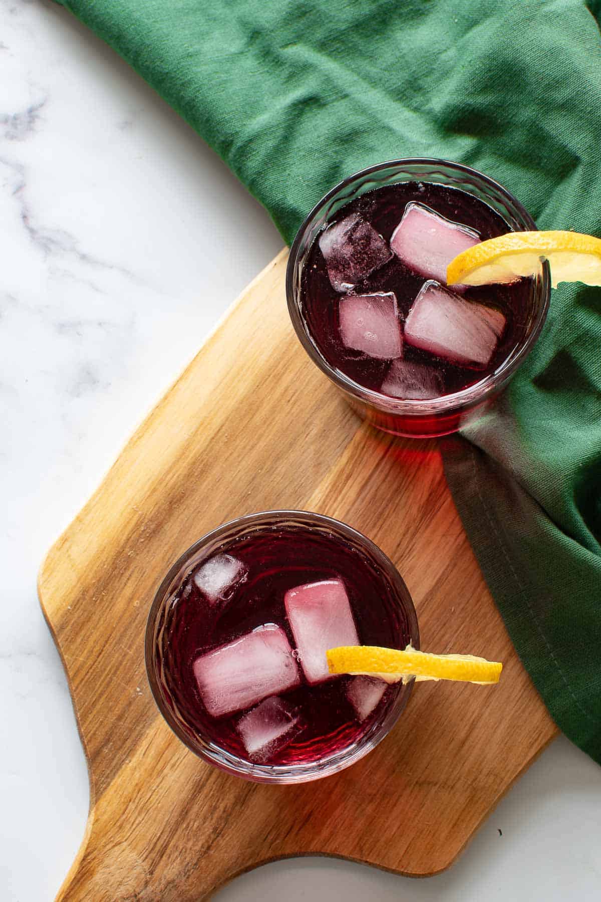 Red wine spritzer on a wooden board.