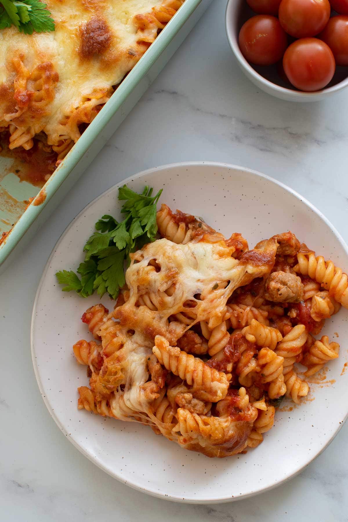 Pasta bake with sausage on a plate.