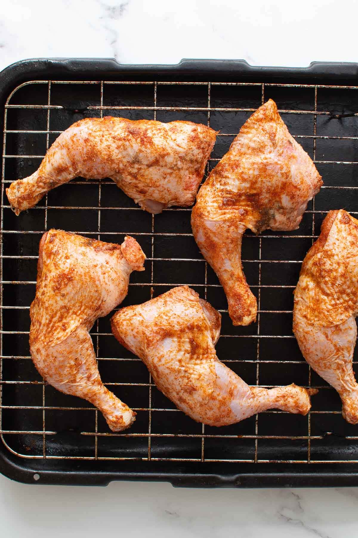 Seasoned chicken quarters.