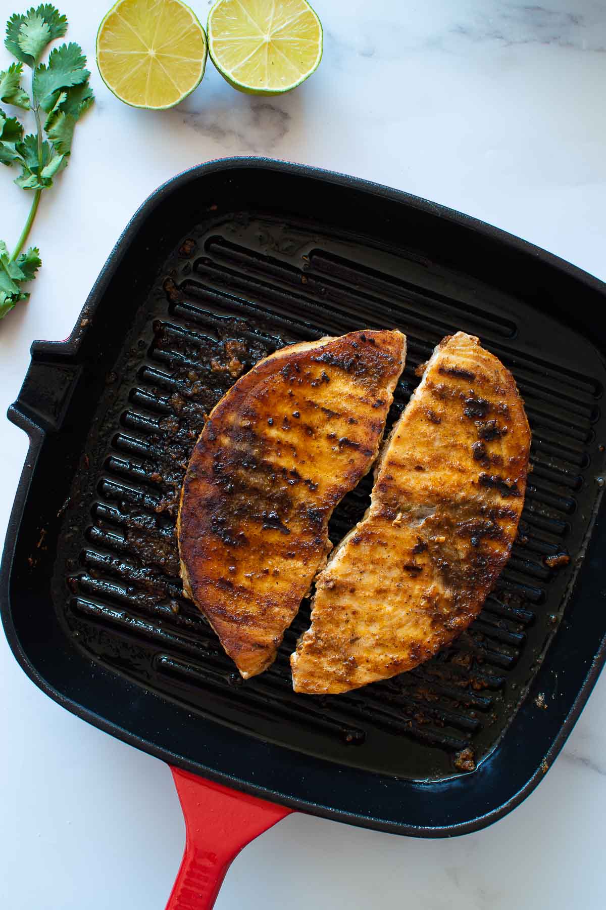 Grilled swordfish in a pan.