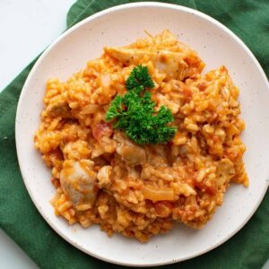 Chicken and chorizo risotto on a plate.