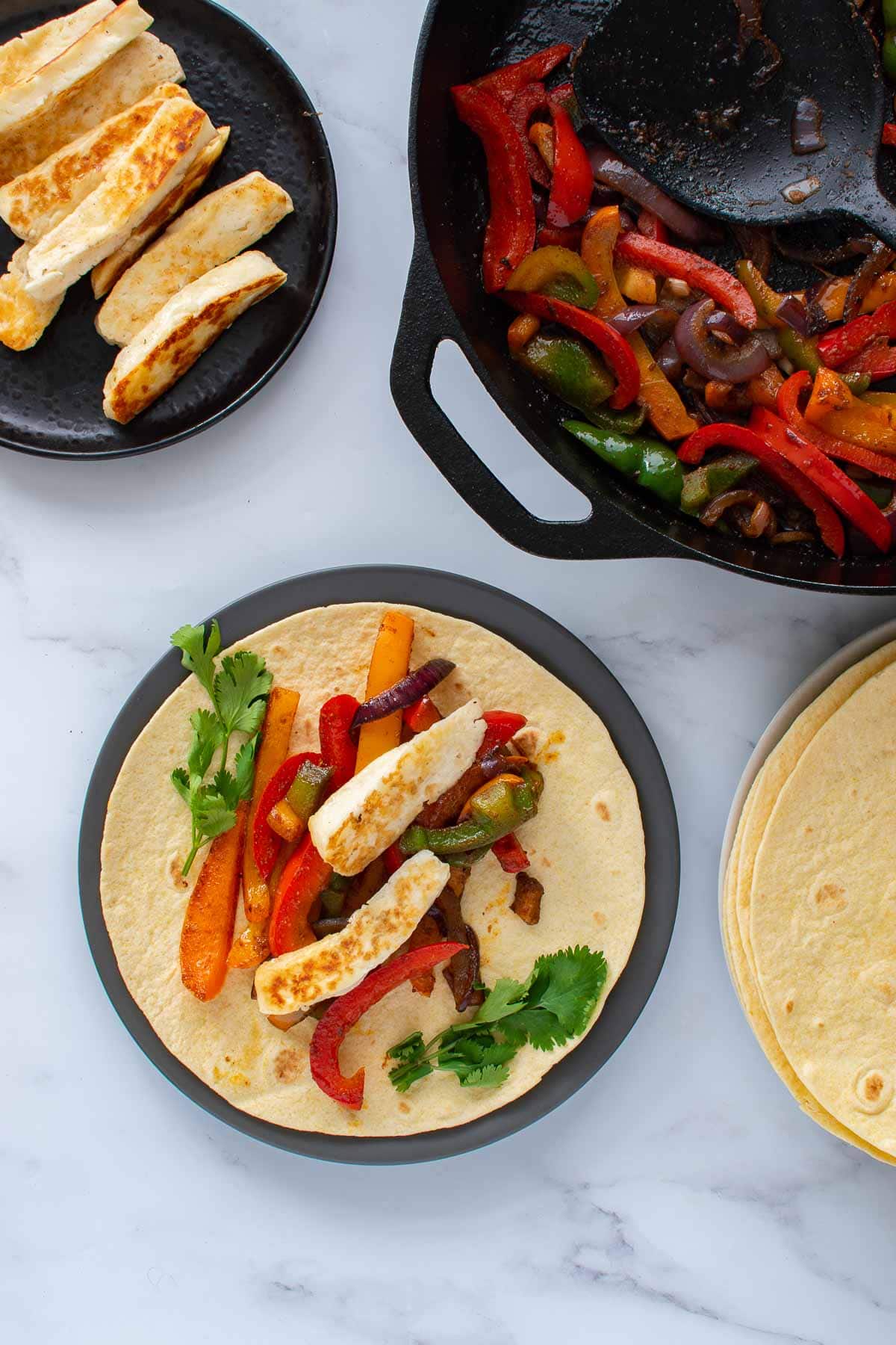 Fajitas with peppers and halloumi.