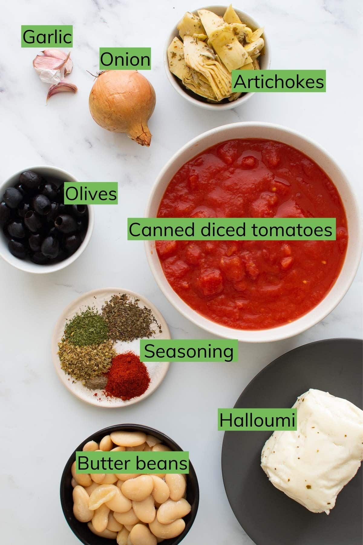 The ingredients to make baked halloumi laid out on a table.