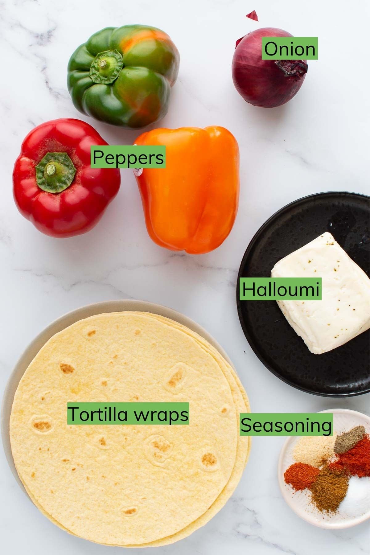 The ingredients needed to make halloumi cheese fajitas laid out on a table.