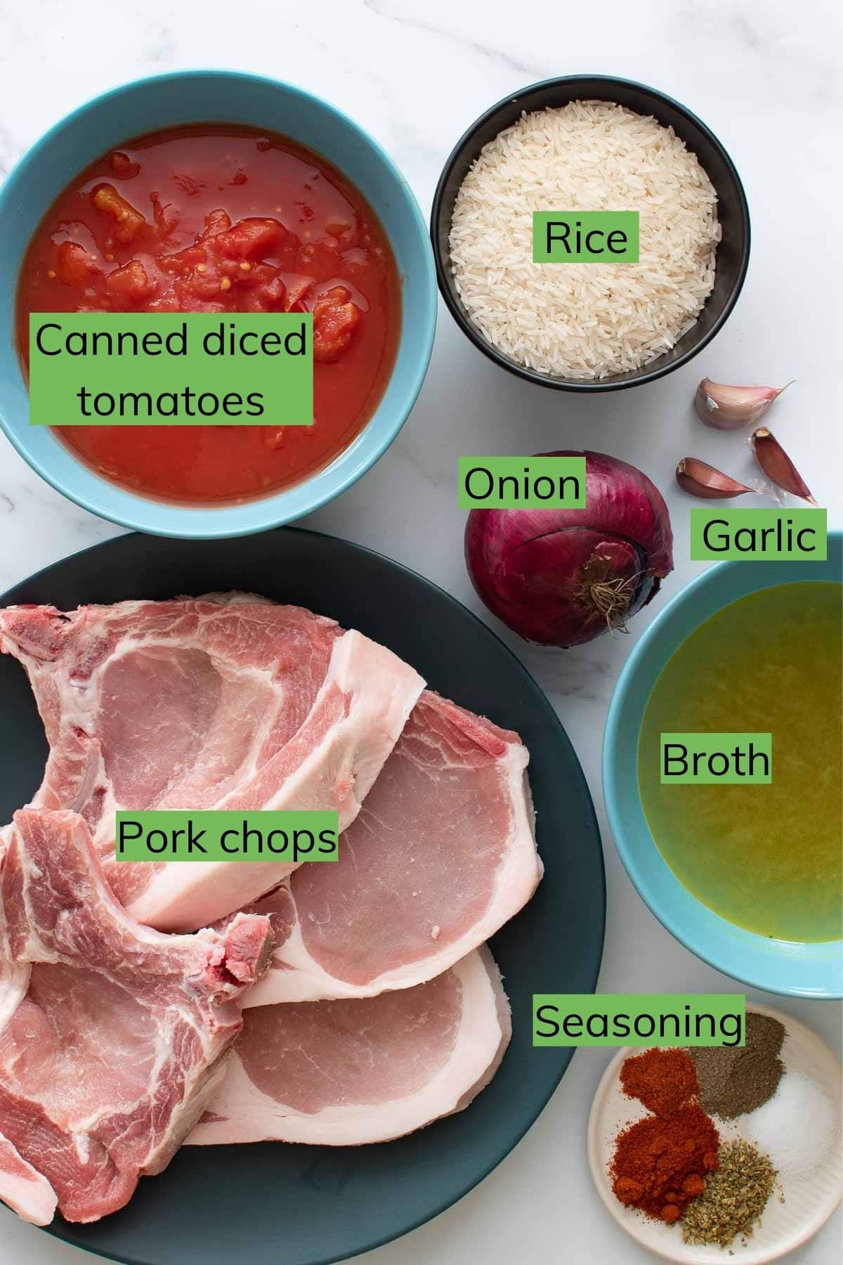 The ingredients needed to make pork chops and rice in the Instant Pot laid out on a table.