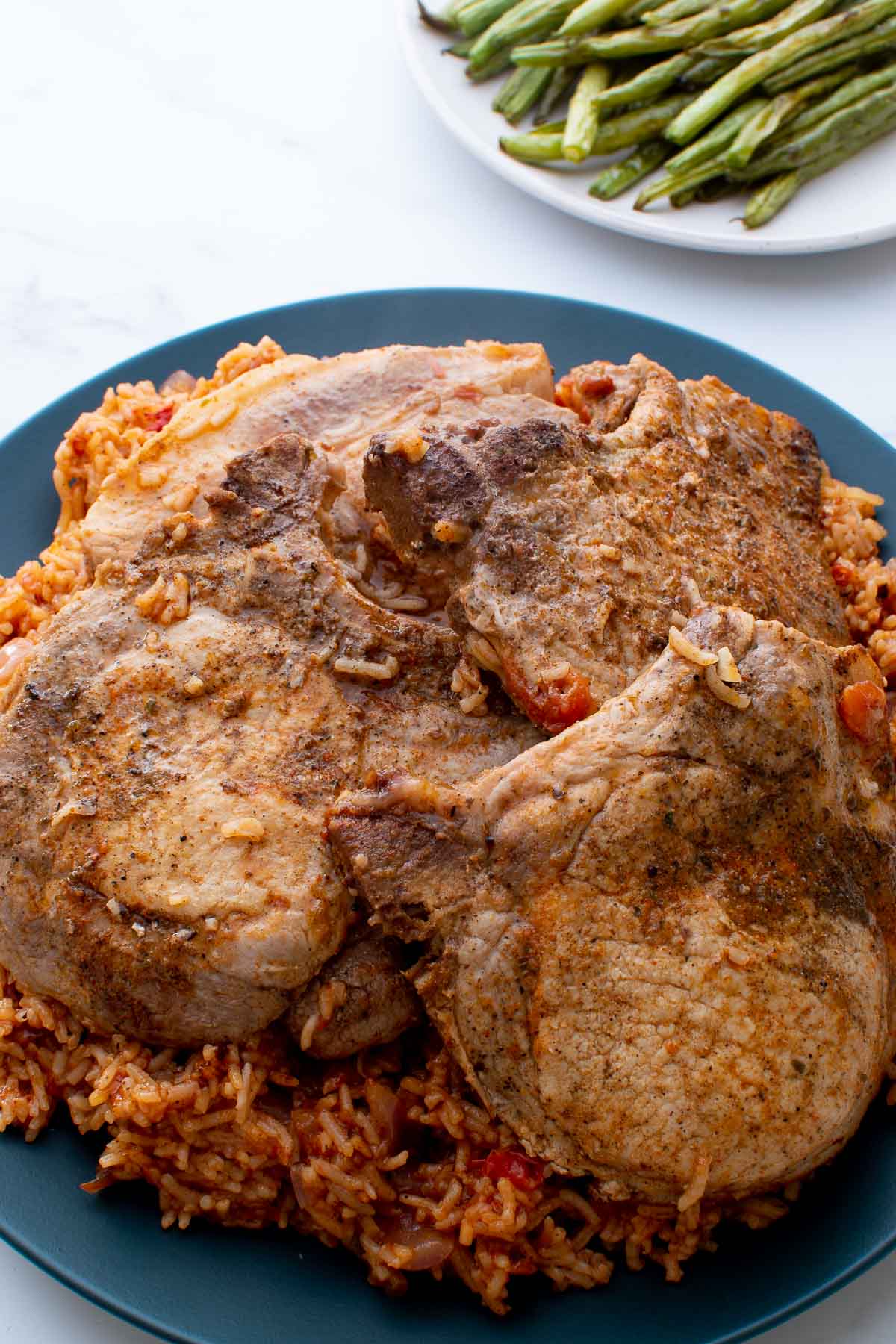 Close up of rice and pork chops.