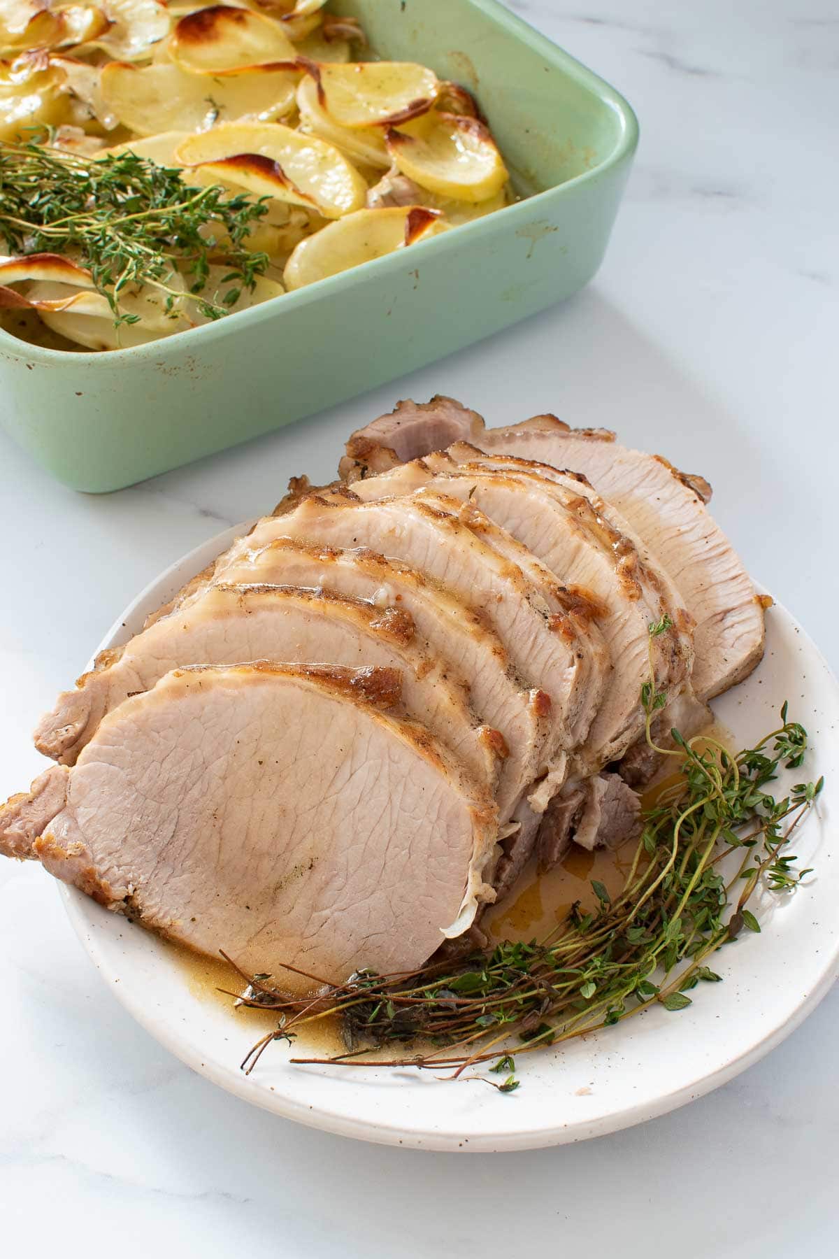 Instant pot pork loin with potatoes and thyme.