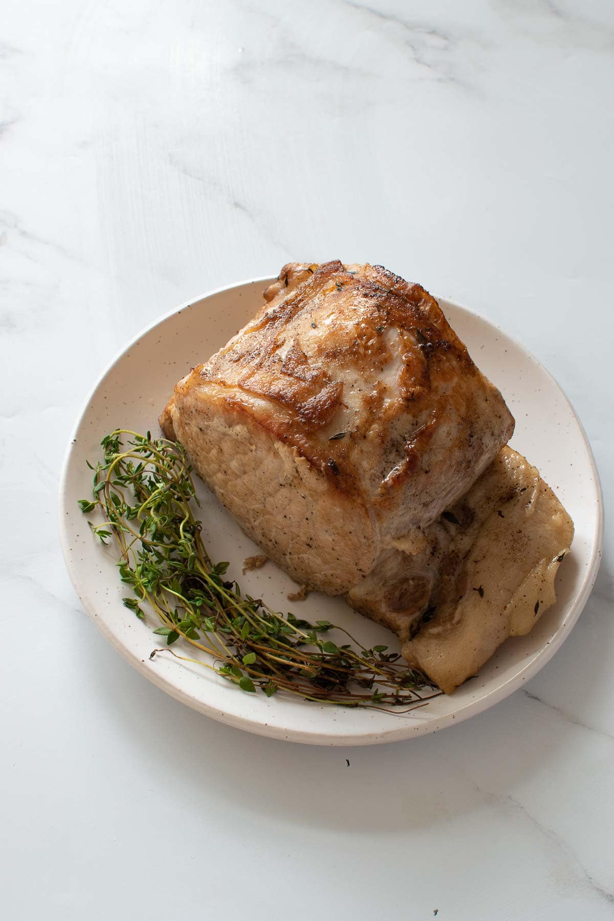 Pressure cooked pork loin roast on a plate.