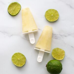 Lime popsicles and sliced lime.