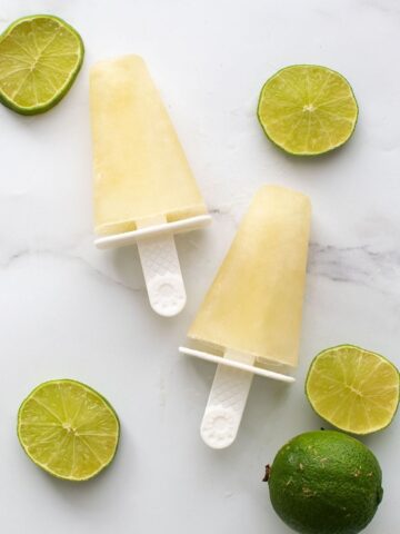 Lime popsicles and sliced lime.