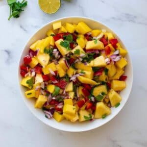 Pineapple mango salsa with cilantro and lime.