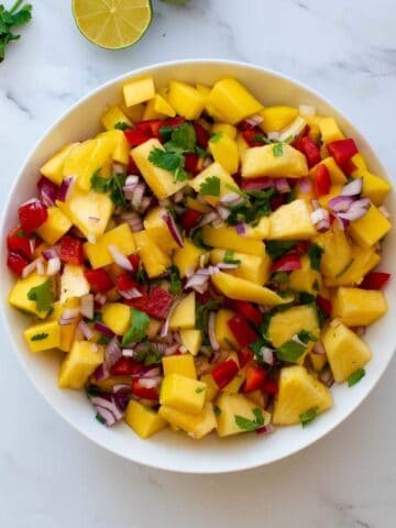 Pineapple mango salsa with cilantro and lime.