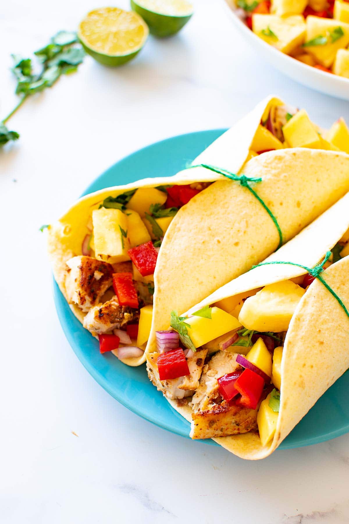 Tacos with fish, pineapple and mango.