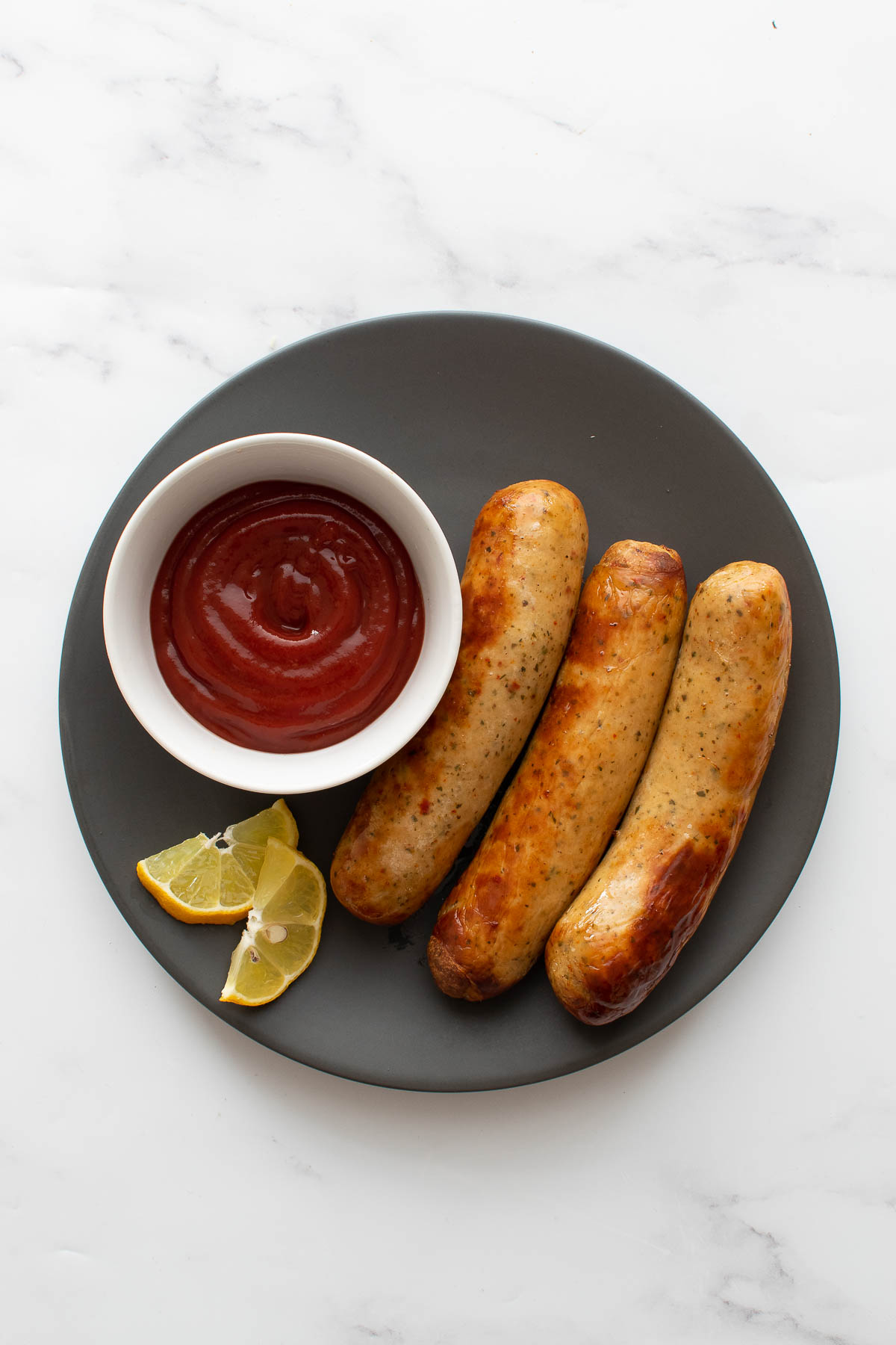 Brats with ketchup.