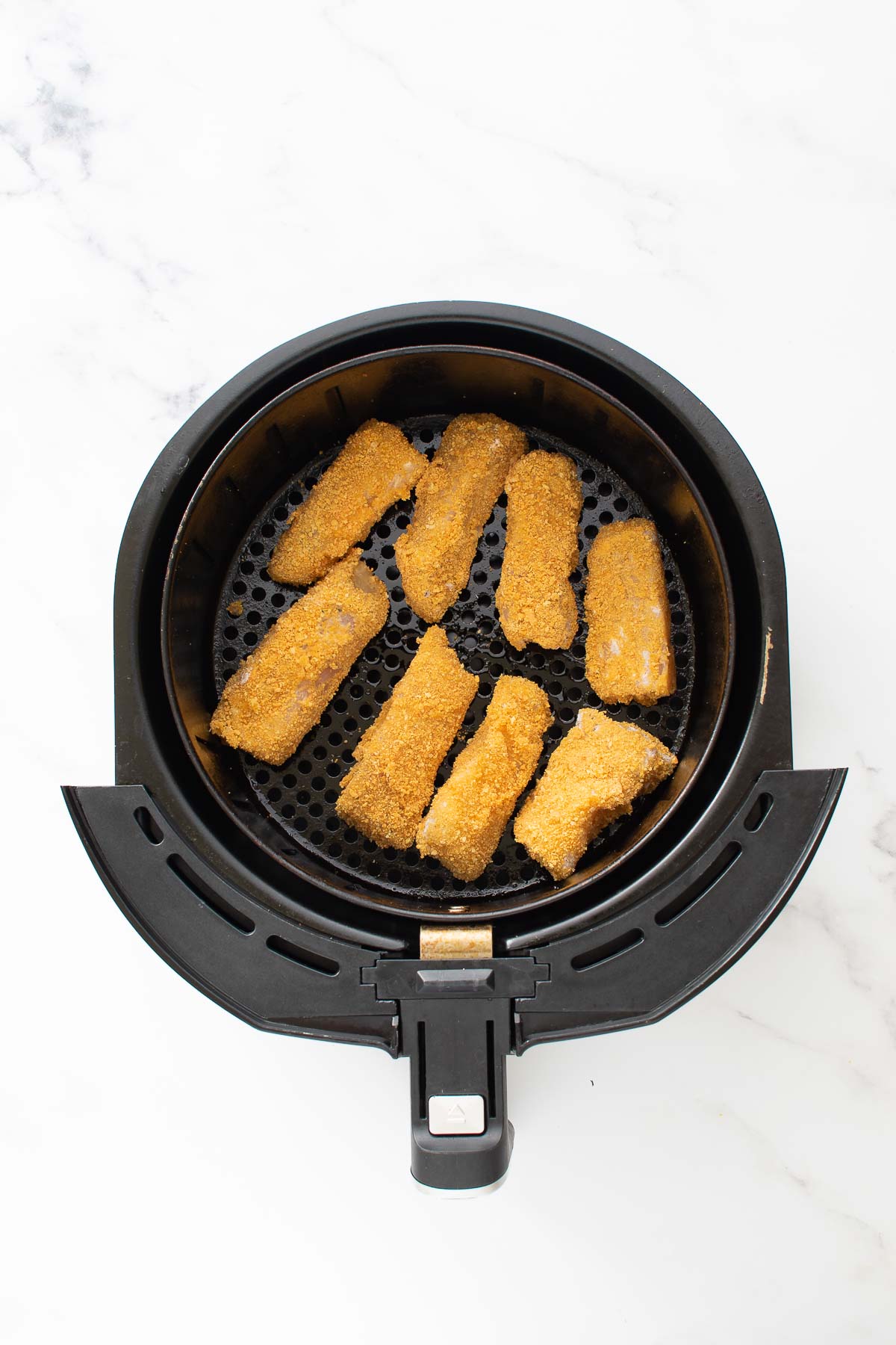 Fish sticks in an air fryer.