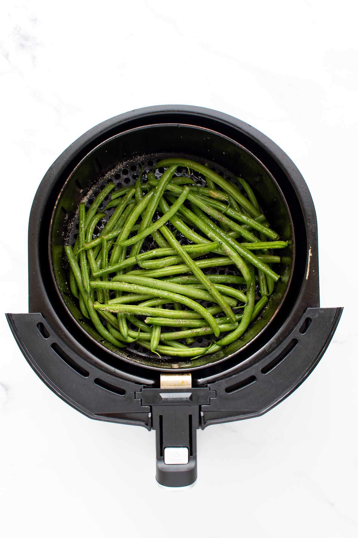 Raw green beans in air fryer.