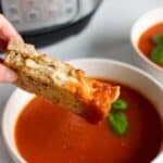 Air fryer grilled cheese dipped in tomato sauce.