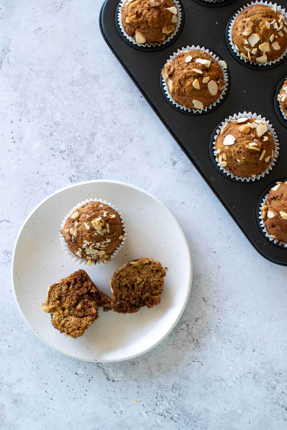 An opened carrot cake banana muffin.