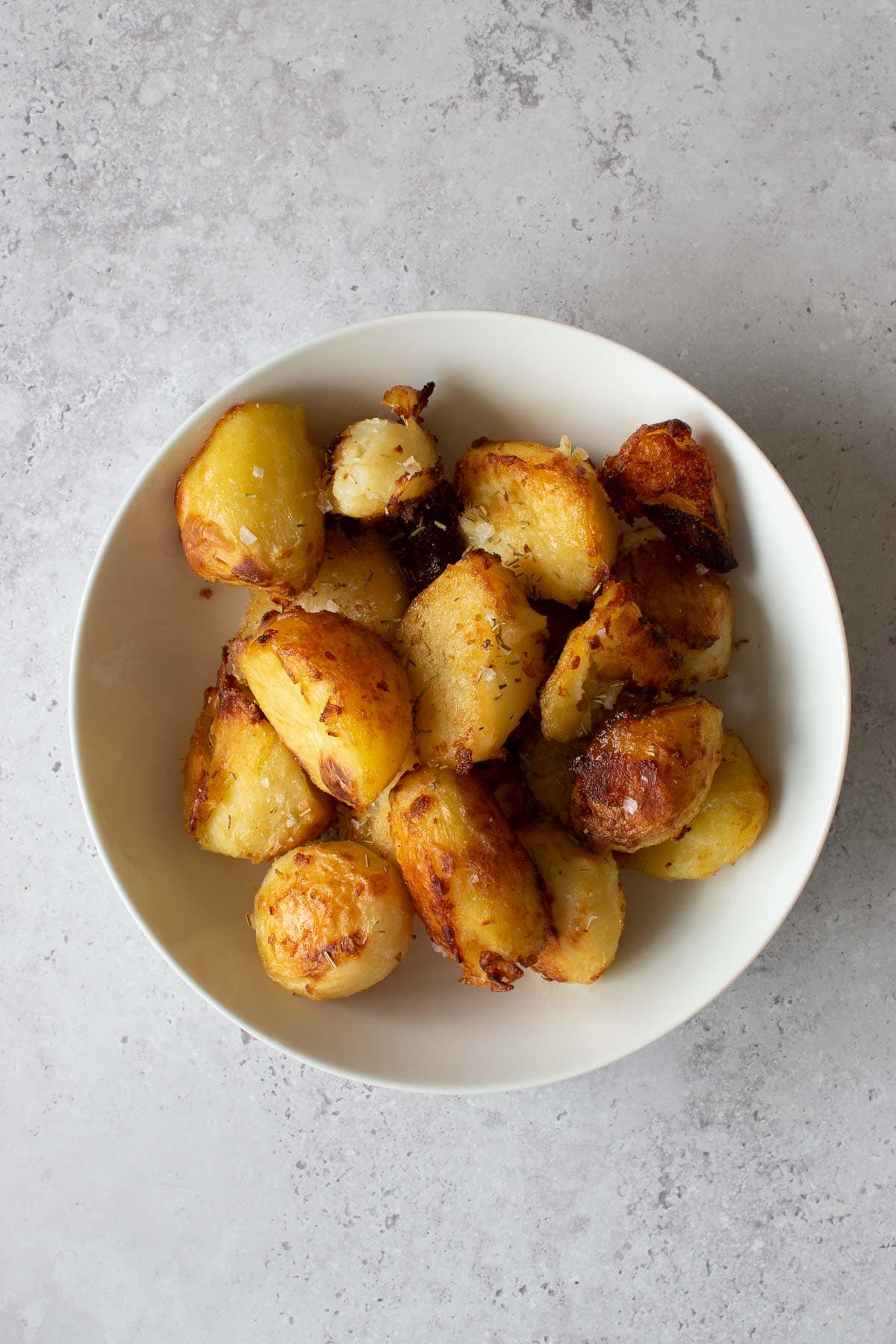 A bowl of roasted potatoes.
