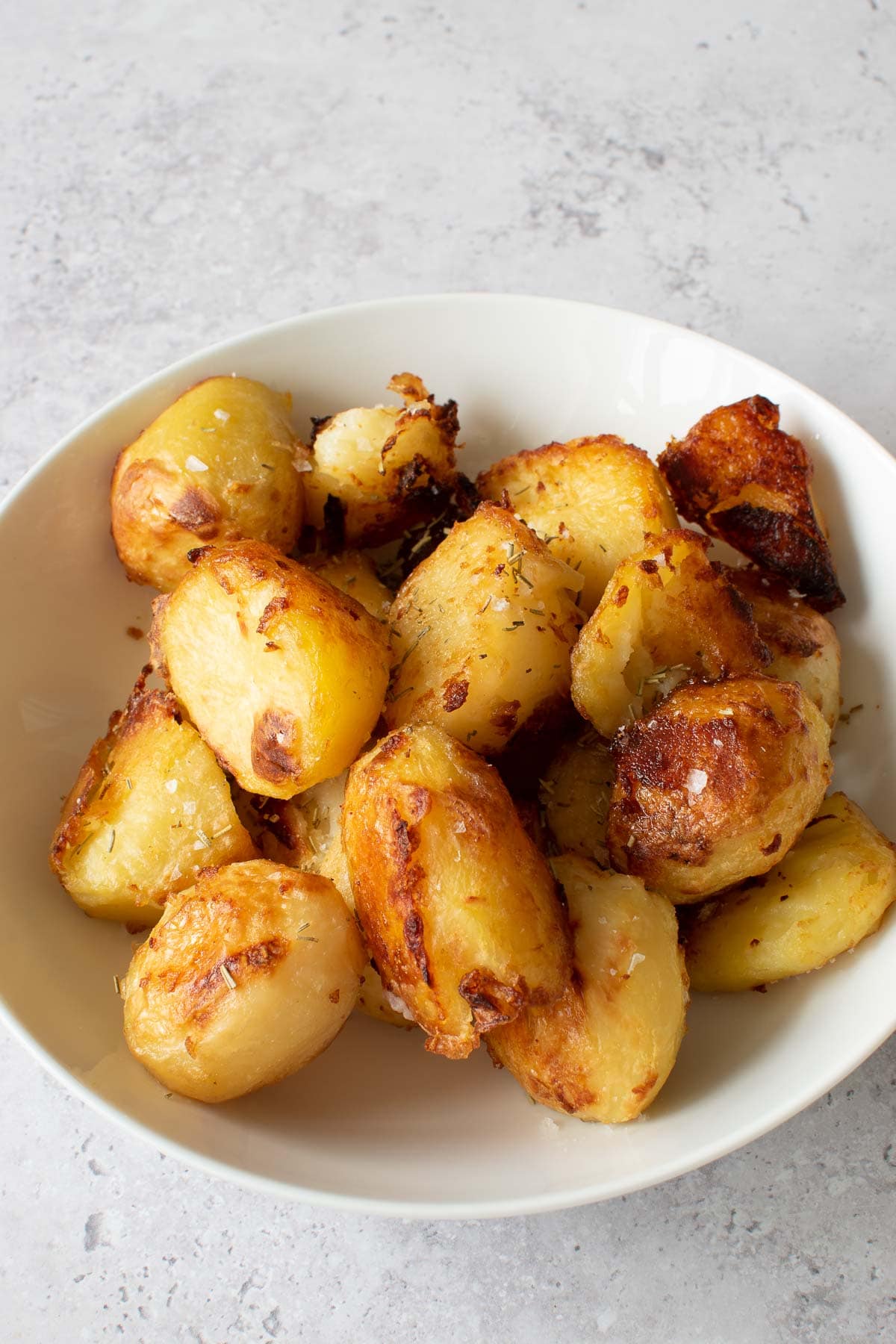 Rosemary roasted potatoes in a bowl.