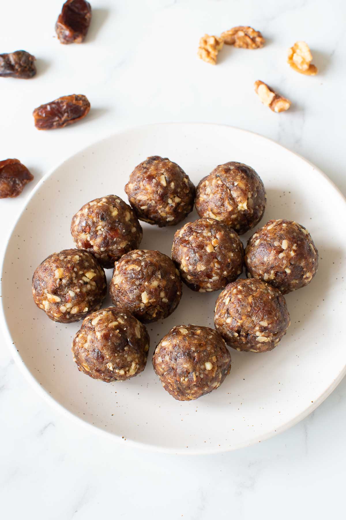 Date walnut balls on a plate.