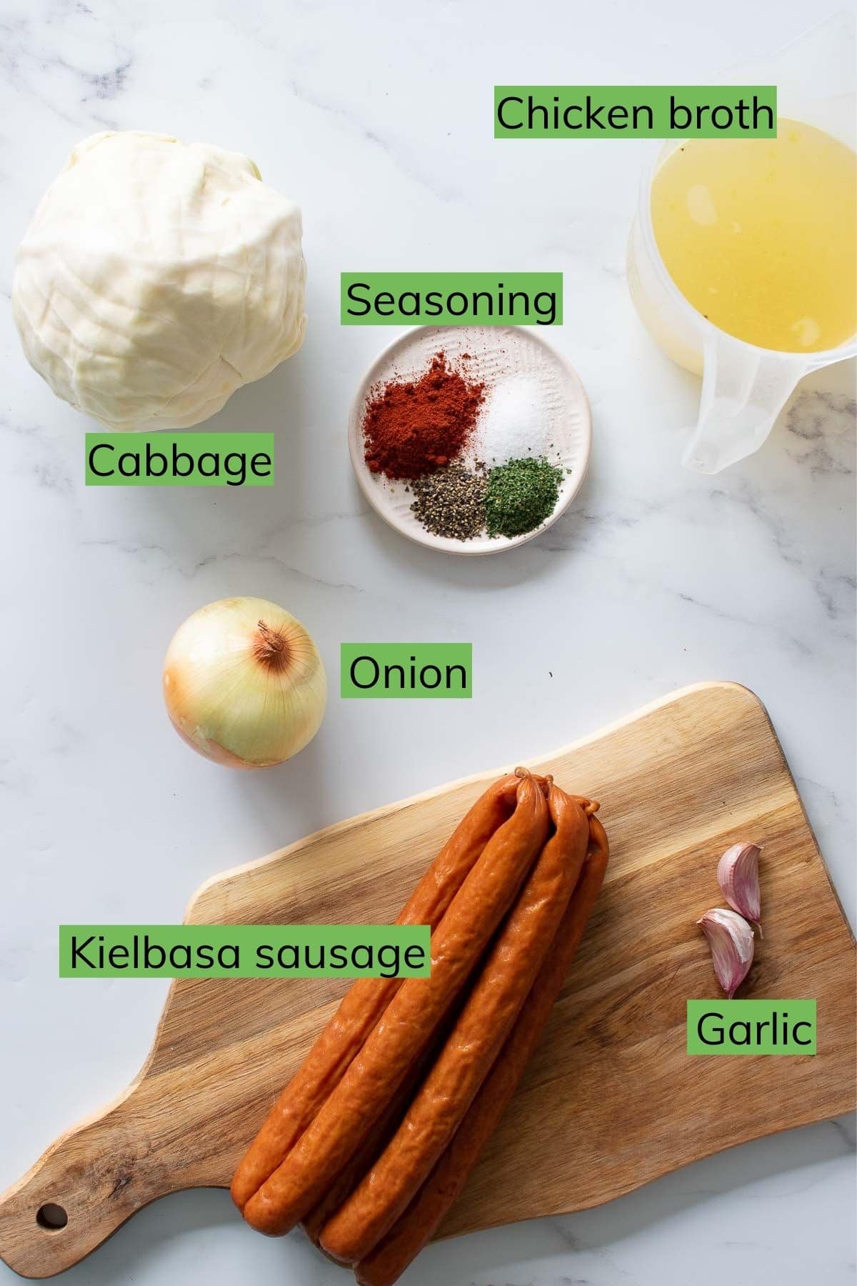 The ingredients needed to make polish sausage and cabbage.