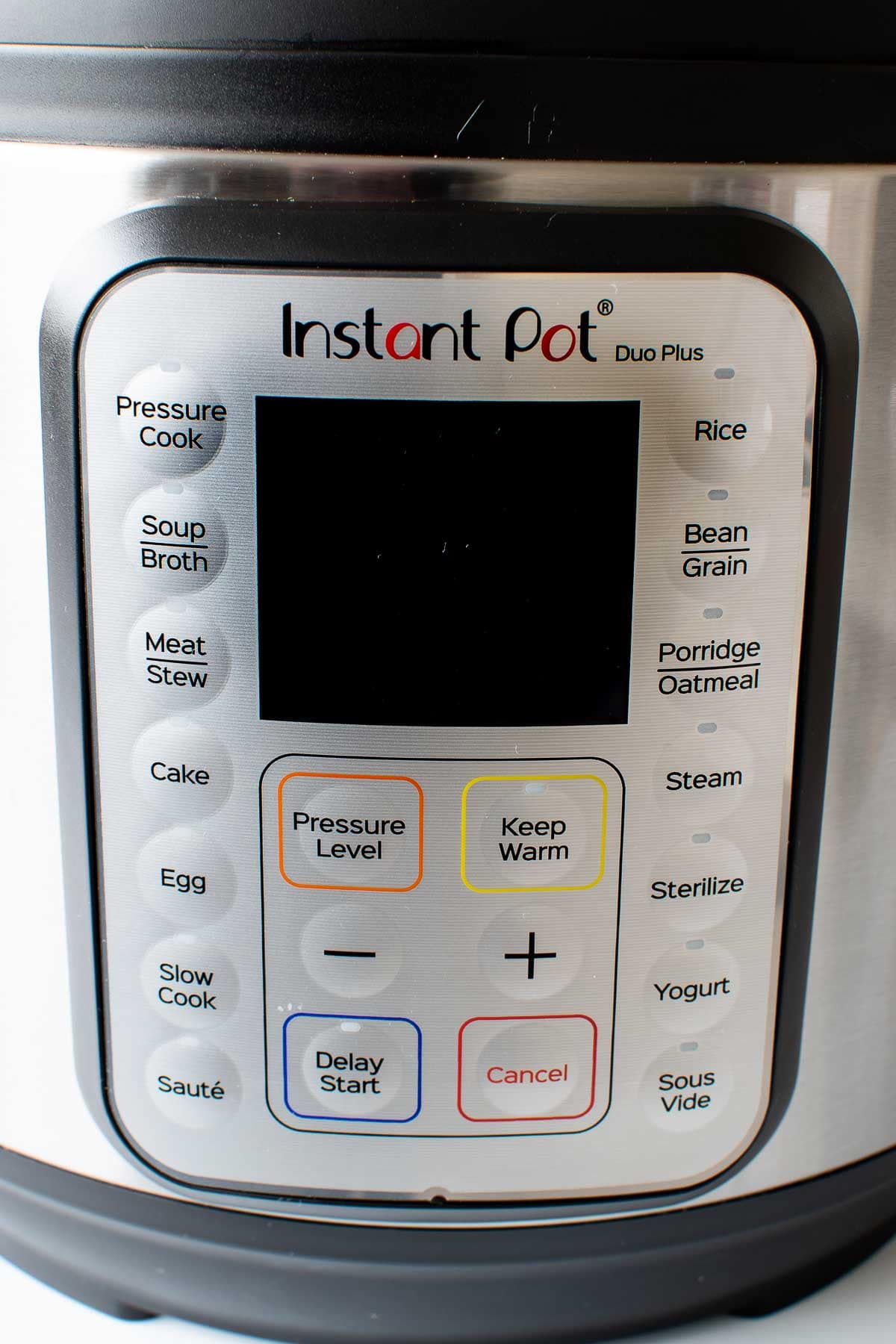 Close up of Instant Pot buttons.