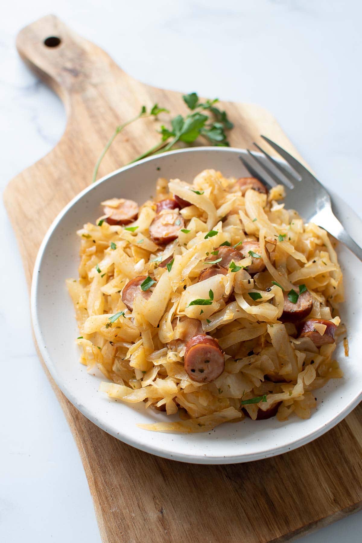 Sausage and cabbage skillet on a plate.