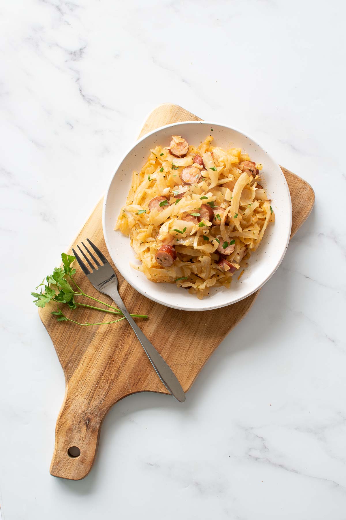 Kielbasa sausage and cabbage skillet meal on a plate.