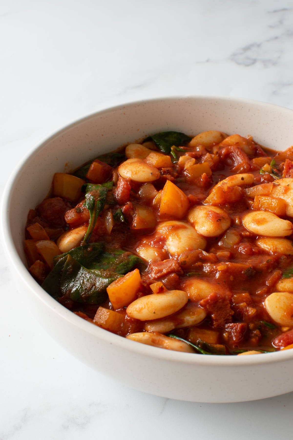 A bowl of butter bean stew with chorizo.