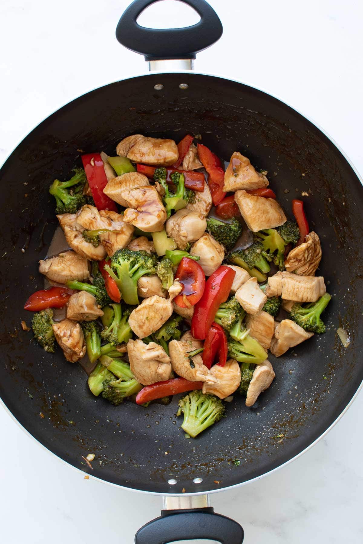 Chicken stir fry in a wok.