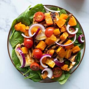 Halloumi and butternut squash salad on a plate.