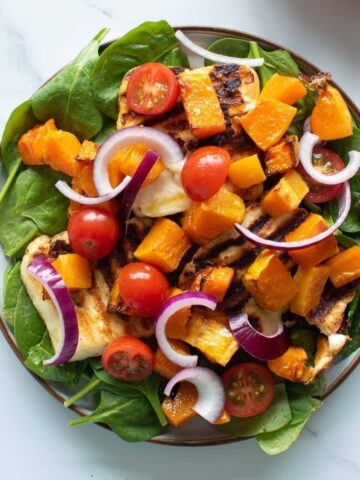 Halloumi and butternut squash salad on a plate.