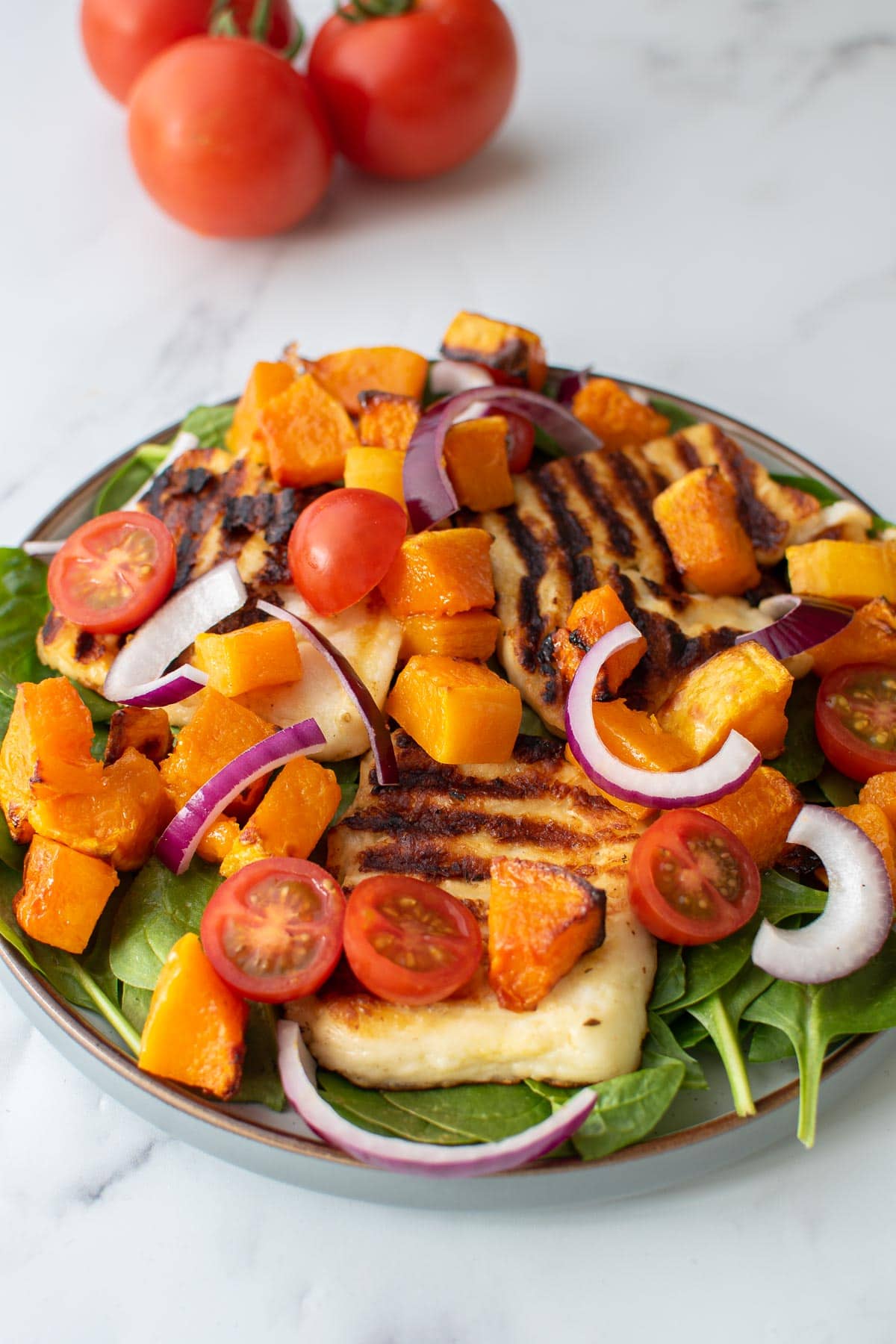 Mixed butternut squash salad with halloumi.