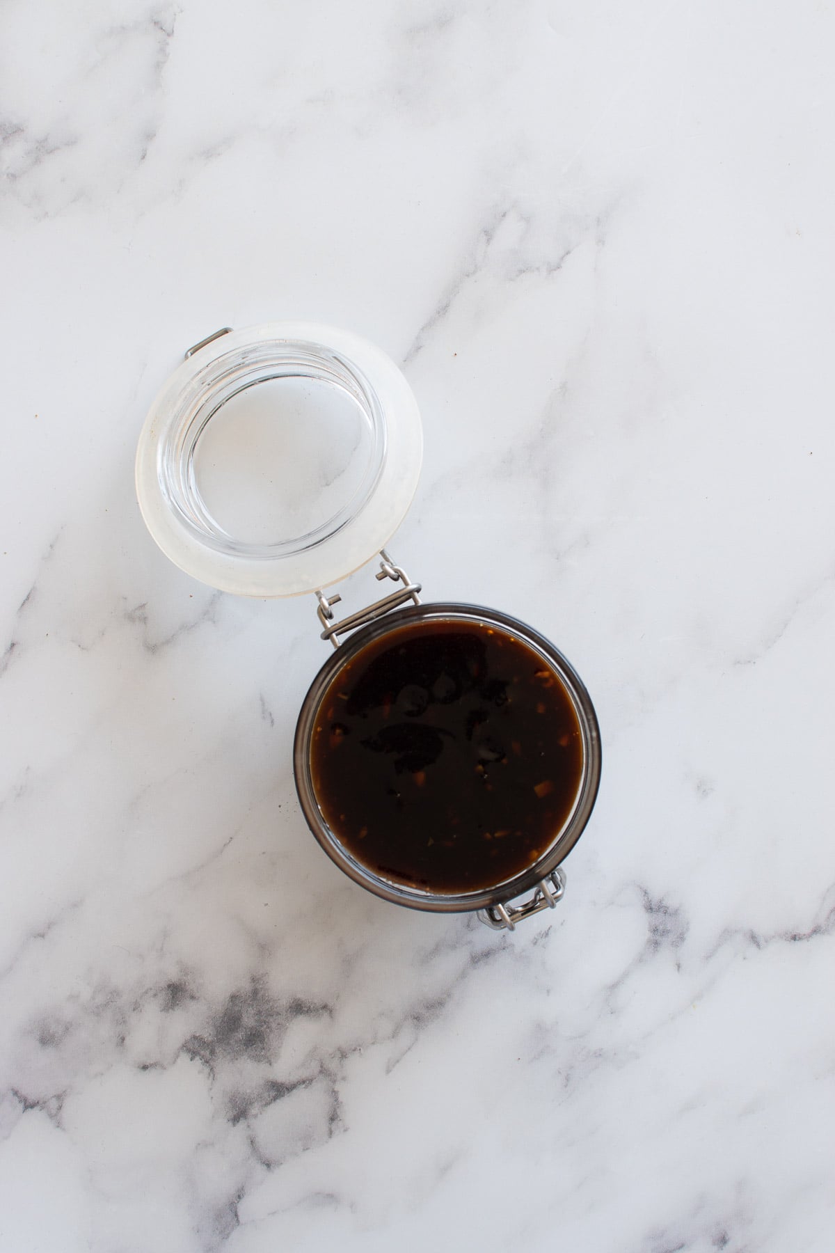 A sealed jar with homemade teriyaki sauce.