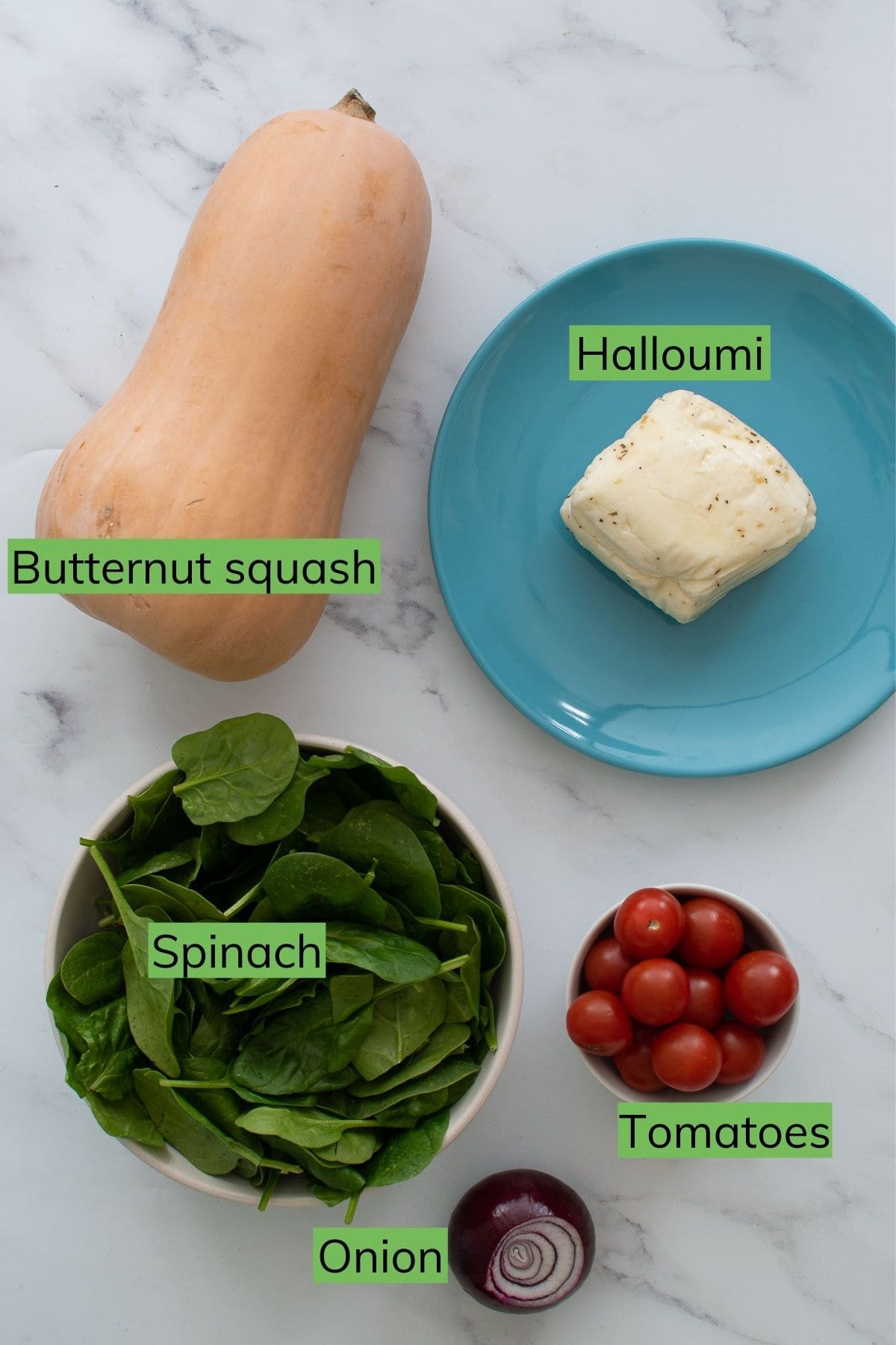 Ingredients for halloumi salad with butternut squash, spinach and tomatoes.