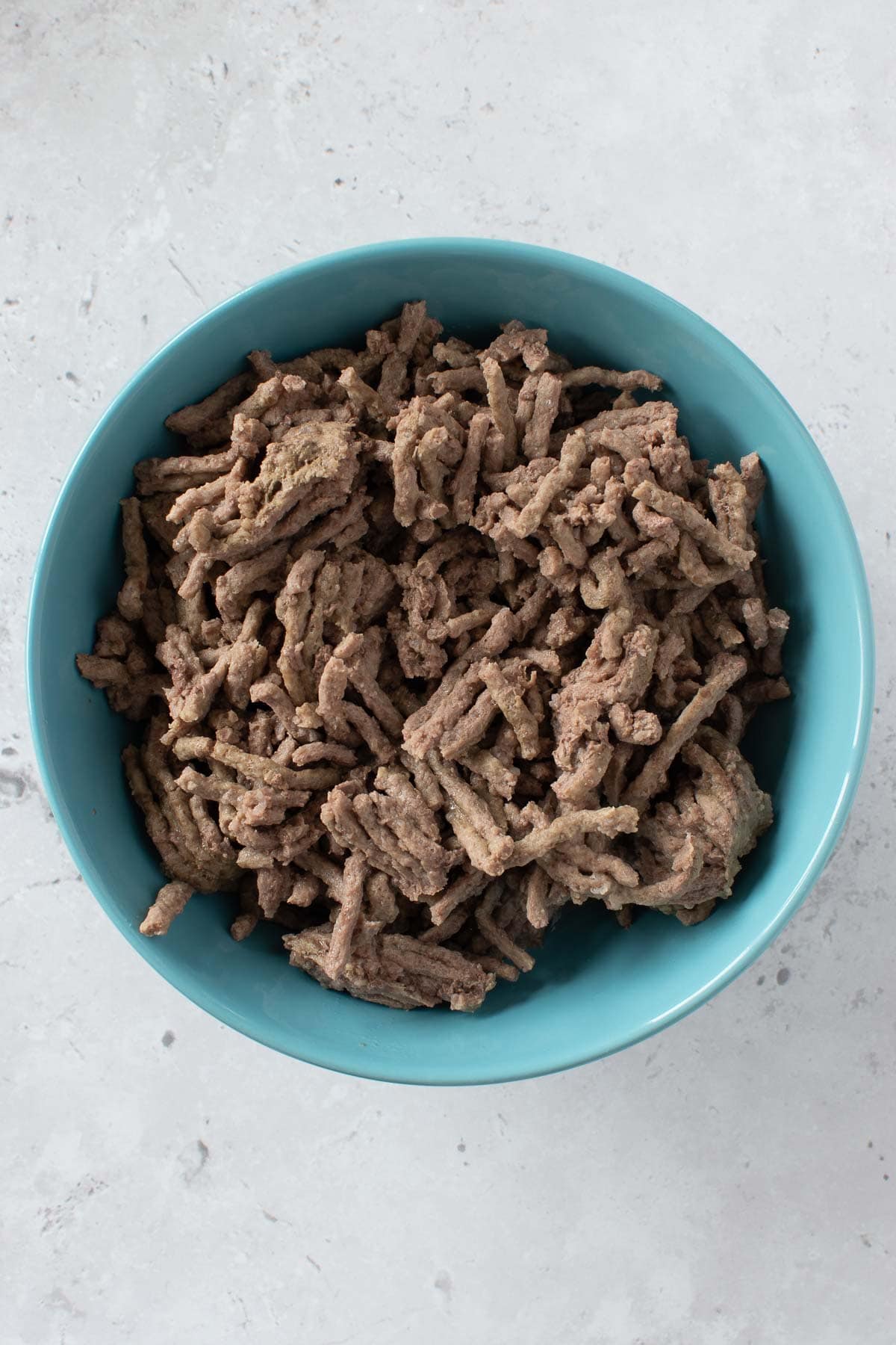 A bowl of pressure cooked ground beef.