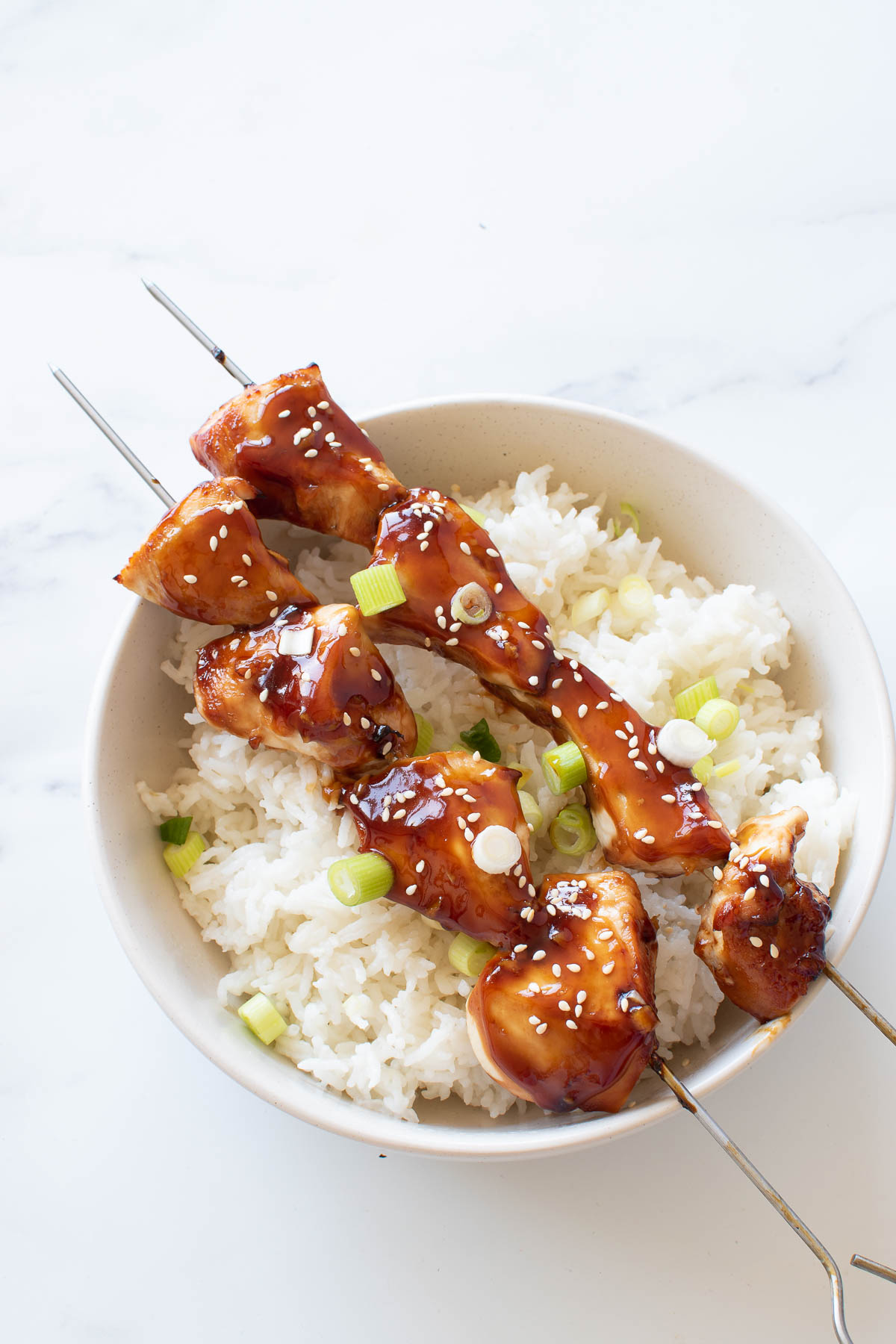 Chicken skewers and rice.