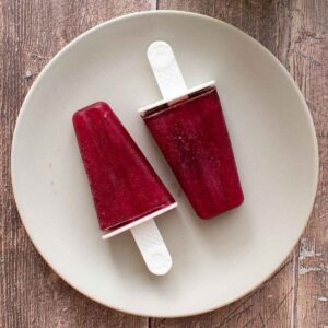 Two wine popsicles on a plate.