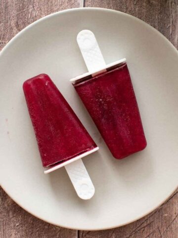 Two wine popsicles on a plate.