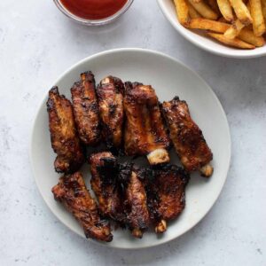 Air fryer ribs on a plate.