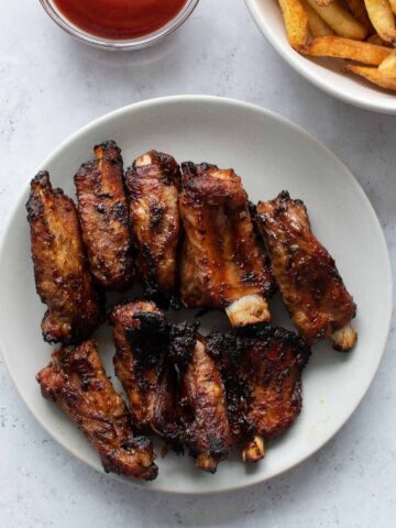 Air fryer ribs on a plate.