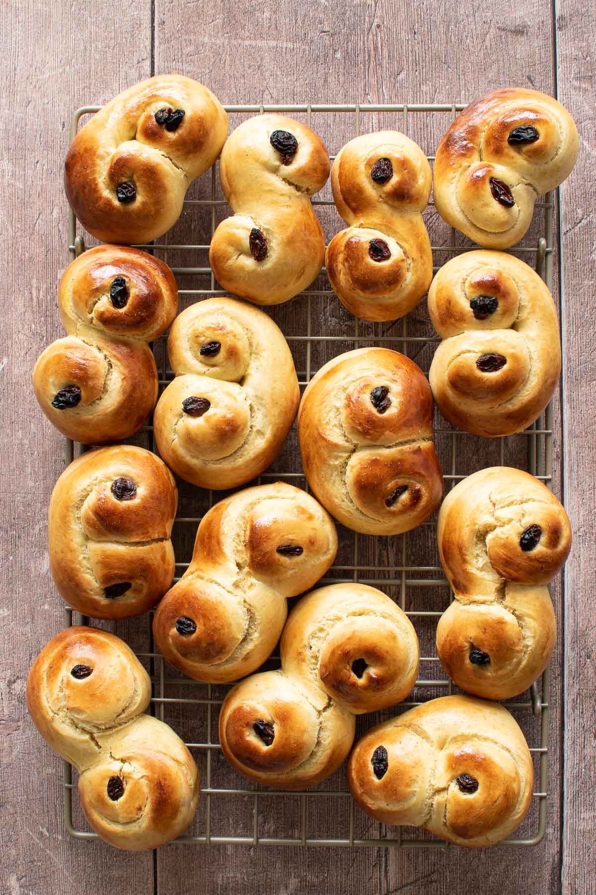 Saffron buns on a cooling rack.