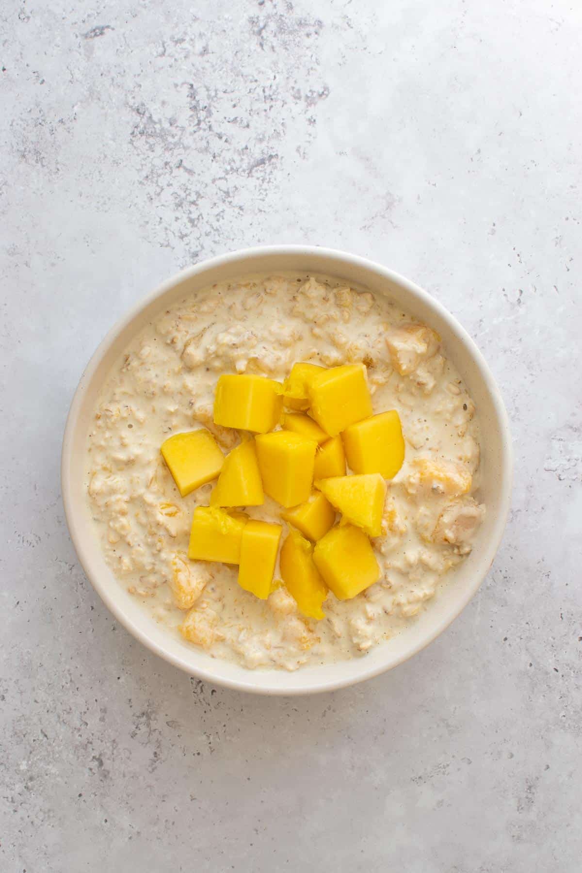 Diced mango on top of overnight oats.